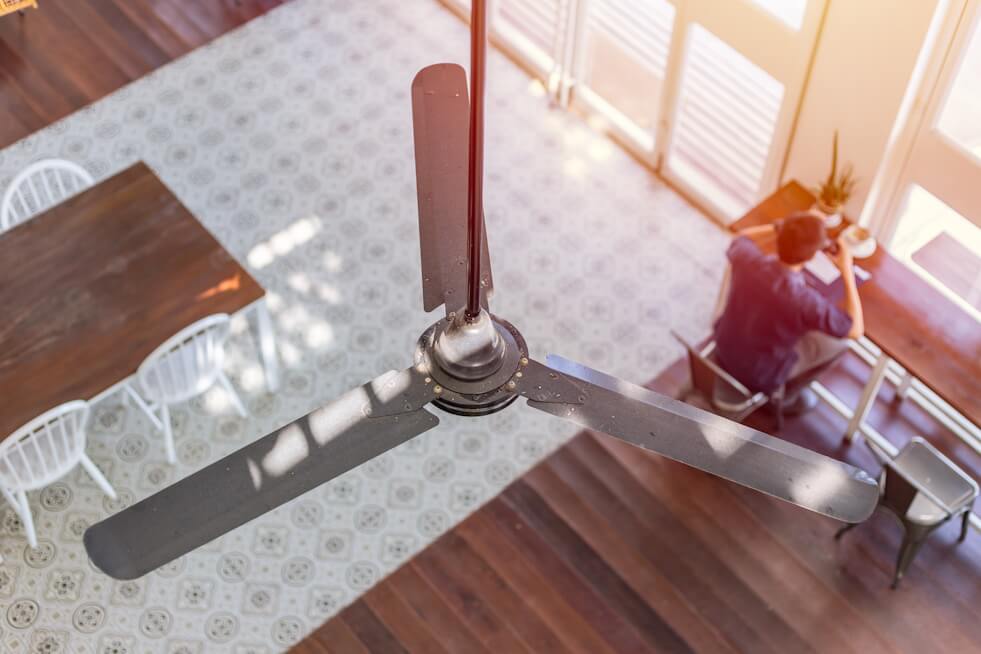 ceiling fan cooling a room during summer