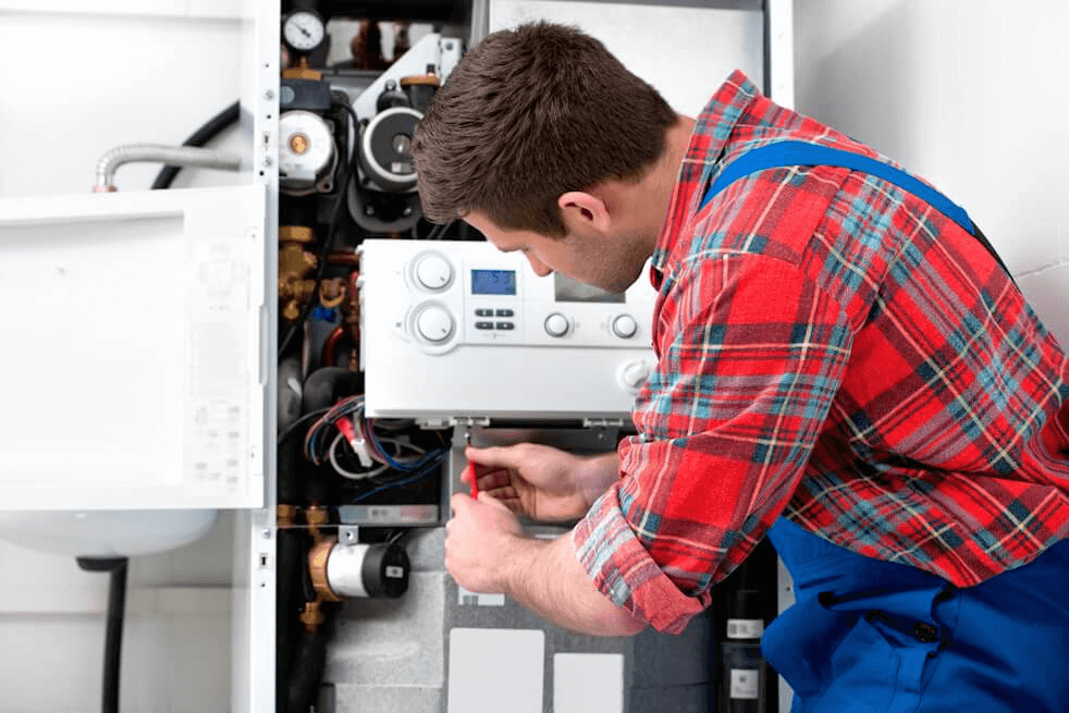 hvac technician installing new furnace